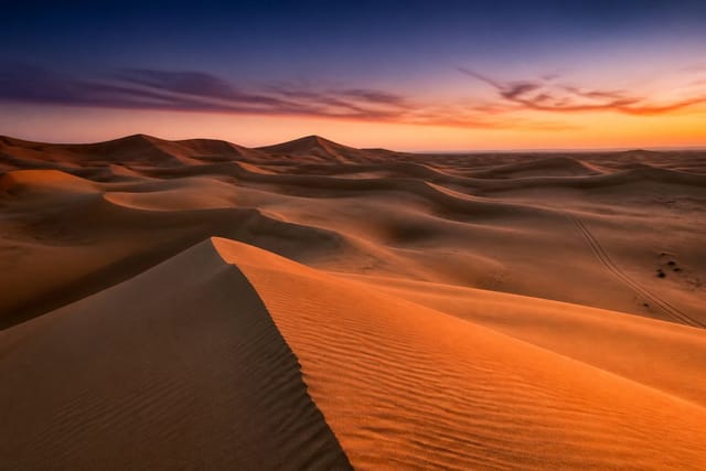 Arabian dunes at last light across the Emirates