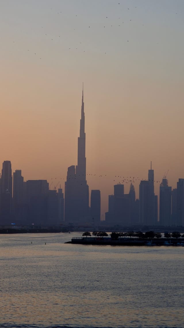 Dubai skyline at dusk near major malls